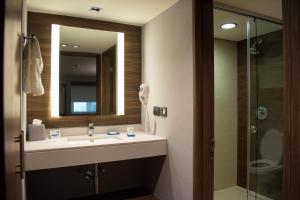 a bathroom with a sink and a shower at Holiday Inn Express Morelia, an IHG Hotel in Morelia