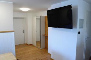 TV a/nebo společenská místnost v ubytování Penthouse mit 4 Schlafzimmer Warum-ins-Hotel