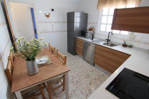 Kuchyňa alebo kuchynka v ubytovaní Alojamiento Armenia Piscina