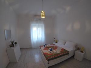 Posteľ alebo postele v izbe v ubytovaní Oudeis Holidays Apartments Tropea