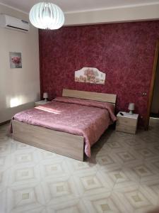 מיטה או מיטות בחדר ב-Case vacanze LE ROSE