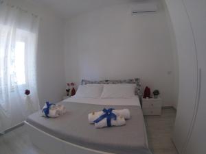 Posteľ alebo postele v izbe v ubytovaní Oudeis Holidays Apartments Tropea