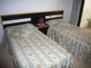 Ένα ή περισσότερα κρεβάτια σε δωμάτιο στο Apartamentos Gemelos IV - Fincas Arena