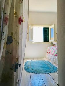 Un pat sau paturi într-o cameră la Pangiotas Pencione