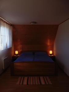 Postel nebo postele na pokoji v ubytování CHATA JASNA 2km od TATRALANDIE