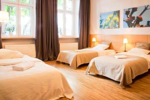 Łóżko lub łóżka w pokoju w obiekcie Apartamenty 23