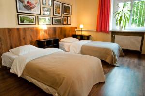 Łóżko lub łóżka w pokoju w obiekcie Apartamenty 23