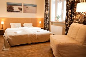 Łóżko lub łóżka w pokoju w obiekcie Apartamenty 23