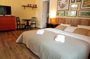 Łóżko lub łóżka w pokoju w obiekcie Apartamenty 23