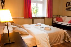 Łóżko lub łóżka w pokoju w obiekcie Apartamenty 23