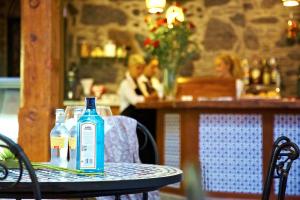 a bottle of alcohol sitting on a table in a restaurant at Hotel Emblemático San Agustin in Icod de los Vinos