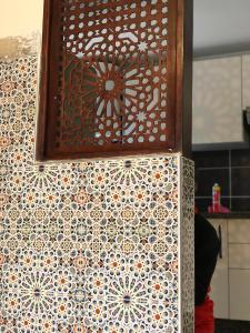 a wall with a design on it in a kitchen at Oued Laou - Ground Floor in Oued Laou +21 photos