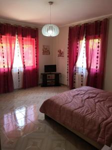 Posteľ alebo postele v izbe v ubytovaní Case vacanze LE ROSE
