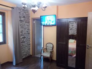 TV a/nebo společenská místnost v ubytování A Casa do Ferrador