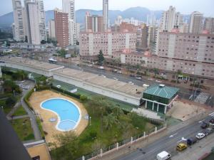 a view of a city with a swimming pool and a road at Gemelos XII - Fincas Arena in Benidorm
