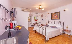 Ένα ή περισσότερα κρεβάτια σε δωμάτιο στο Apartments Cathedral