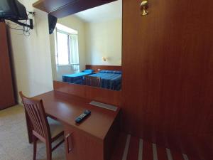 TV a/nebo společenská místnost v ubytování Hotel Ferrari