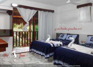 Кровать или кровати в номере Casa CheJum Bacalar