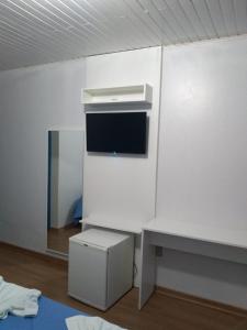 TV a/nebo společenská místnost v ubytování Pousada Recanto Alpino