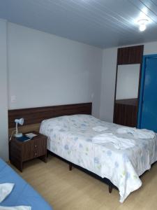 Postel nebo postele na pokoji v ubytování Pousada Recanto Alpino