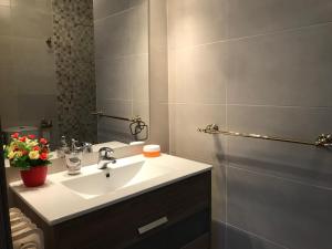 a bathroom with a sink and a mirror at Star of the Sea Miami Playa vacaciones frente al Mar in Miami Platja +27 photos