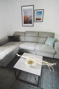 a living room with a couch and a coffee table at Apartments Lucija in Zadar