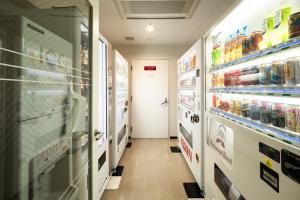 a aisle of a store with shelves of food at Richmond Hotel Utsunomiya-ekimae in Utsunomiya