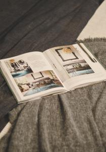 a book sitting on top of a bed at Apartments Lucija in Zadar