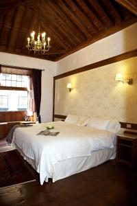 Postel nebo postele na pokoji v ubytování Hotel Emblemático San Agustin
