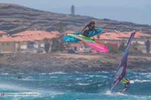 two people are wind surfing in the water at Casa Bonita Médano in El Médano
