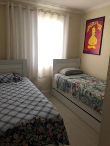 Cama ou camas em um quarto em Apartamento Resort Morumbi