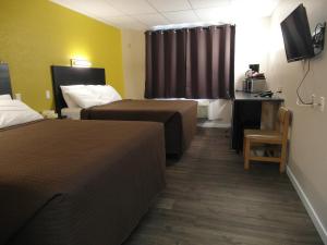 Postel nebo postele na pokoji v ubytování West View Motel