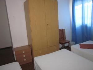Hostal Casa de Huéspedes San Fernando - Adults Only客房内的一张或多张床位