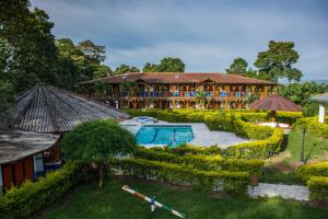 an aerial view of a resort with a pool at Finca Hotel La Dulcera in Armenia