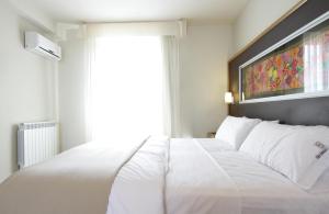 Cama ou camas em um quarto em Plaza Paradiso Petit Hotel