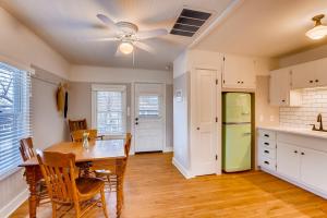 a kitchen with a table and chairs and a refrigerator at Colorado Chautauqua Cottages in Boulder