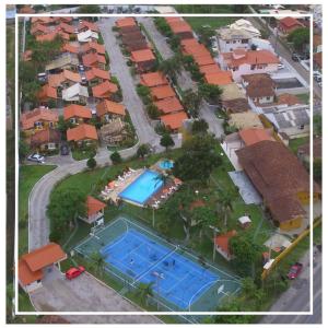 an aerial view of a house with a swimming pool at Chalés Villa Bella in Florianópolis