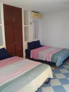 Postel nebo postele na pokoji v ubytování Yucatan Vista Inn Guest House