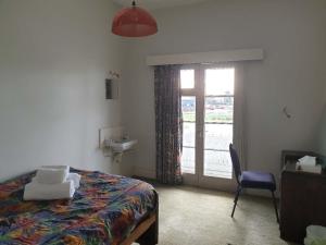 Postel nebo postele na pokoji v ubytování South Rakaia Hotel