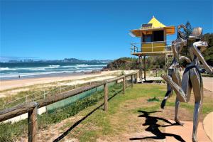 a sculpture of a beach with a lighthouse in the background at Grande Florida Beachside Resort in Gold Coast