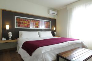 Cama ou camas em um quarto em Plaza Paradiso Petit Hotel