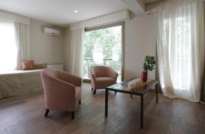 Uma área de estar em Plaza Paradiso Petit Hotel