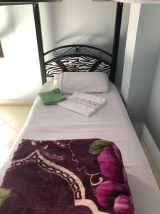 Uma cama ou camas num quarto em TanjaLucia Hostel