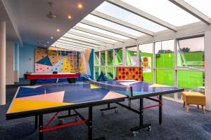 a play room with two ping pong tables at Kingston Hotel in Kingston