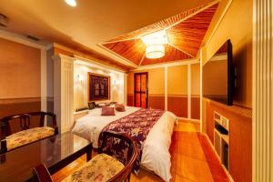 Postel nebo postele na pokoji v ubytování Hotel Lotus Otsu (Adult Only)