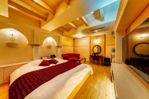 Postel nebo postele na pokoji v ubytování Hotel Lotus Otsu (Adult Only)