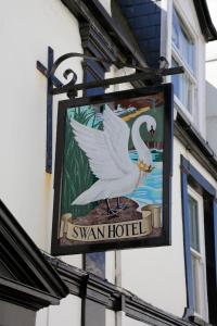 a sign on a building with a bird on it at The Swan Hotel in Wadebridge