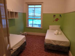 Postel nebo postele na pokoji v ubytování South Rakaia Hotel