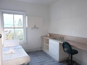 Postel nebo postele na pokoji v ubytování South Rakaia Hotel