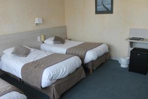 Postel nebo postele na pokoji v ubytování Hotel De La Mer